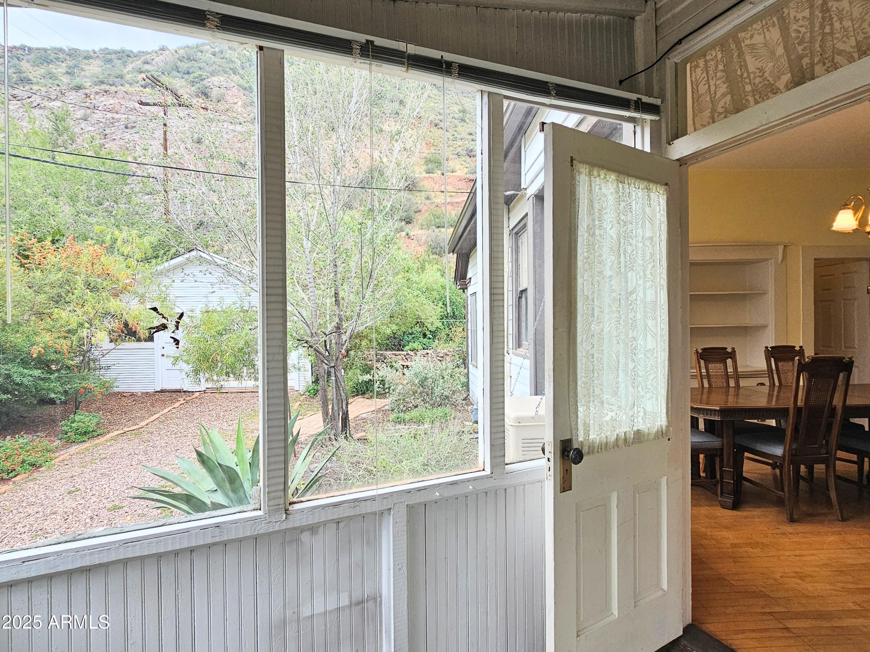 164 Quality Hill Road Bisbee, AZ 85603 - Photo 27 of 36 a view of a room with a large window and dining room