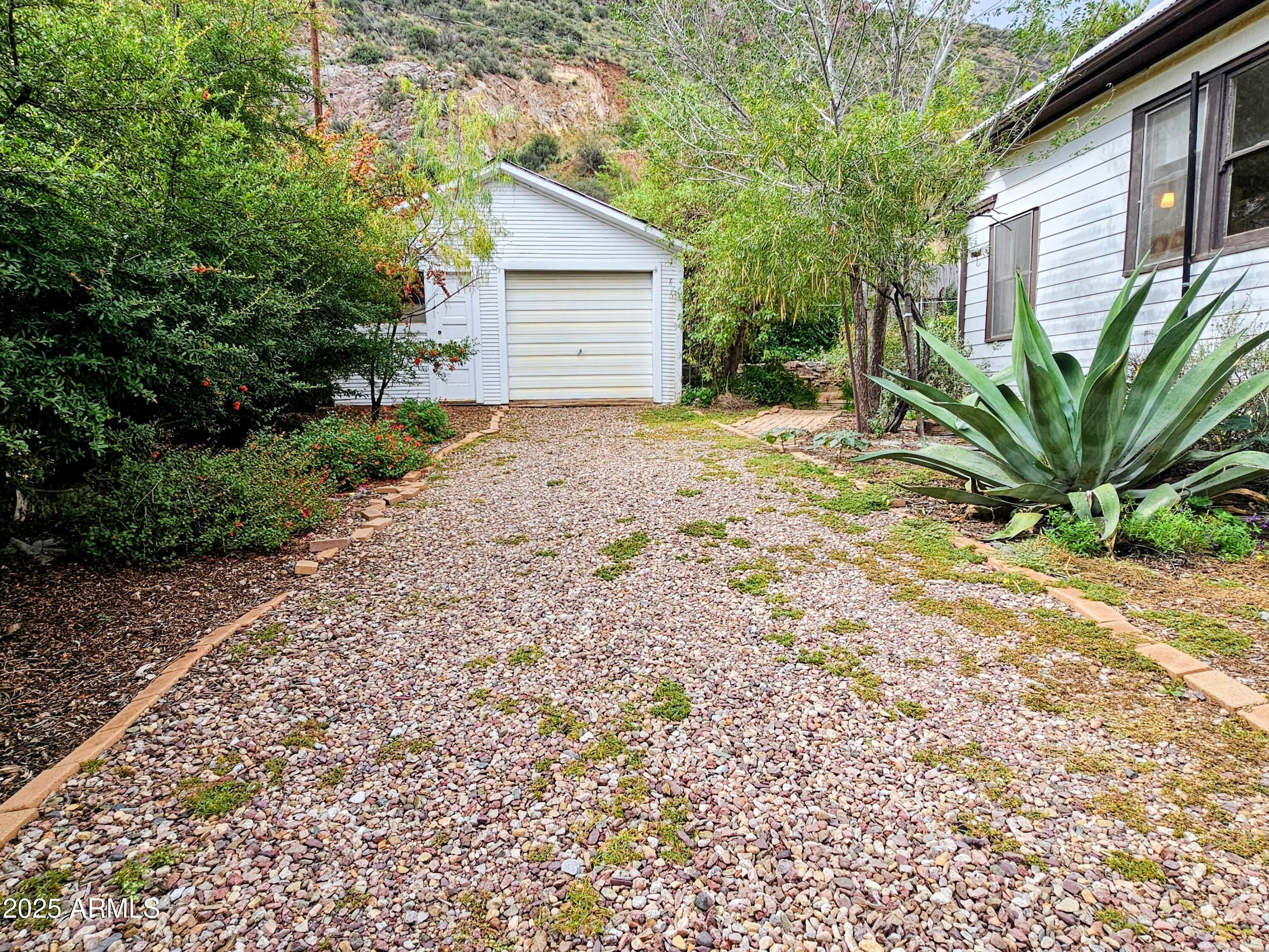 164 Quality Hill Road Bisbee, AZ 85603 - Photo 31 of 36 a view of a house with a yard and plant
