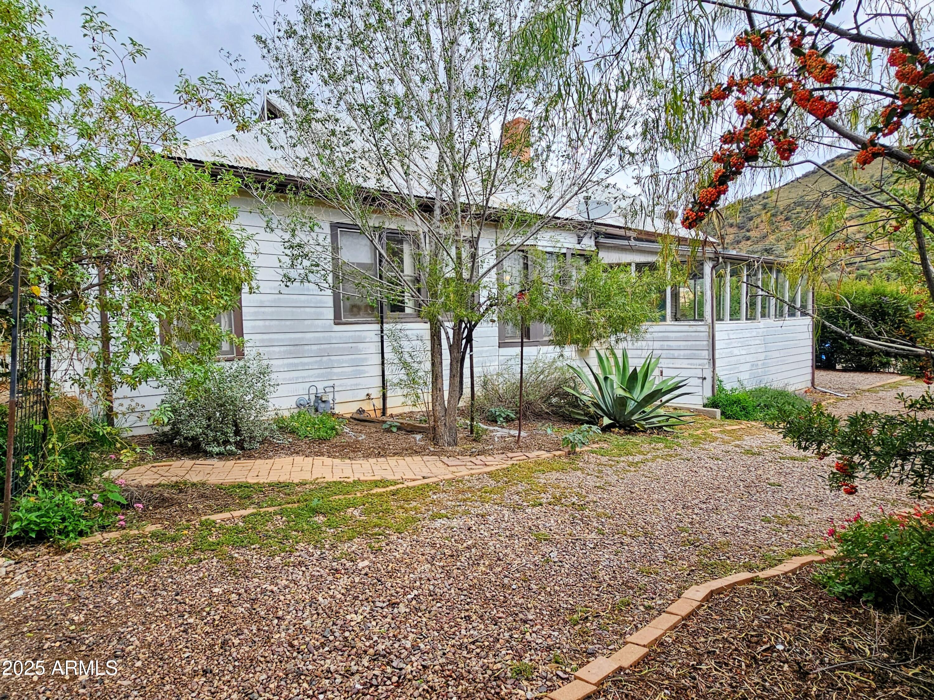 164 Quality Hill Road Bisbee, AZ 85603 - Photo 33 of 36 a view of a house with a yard