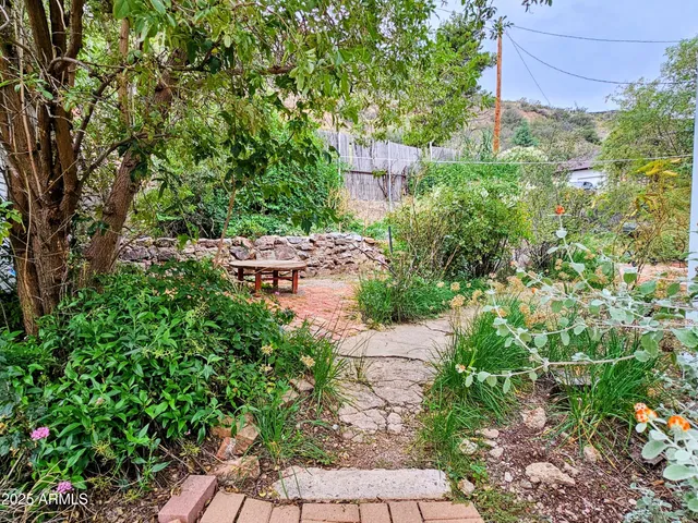 a view of a house with a yard and garage