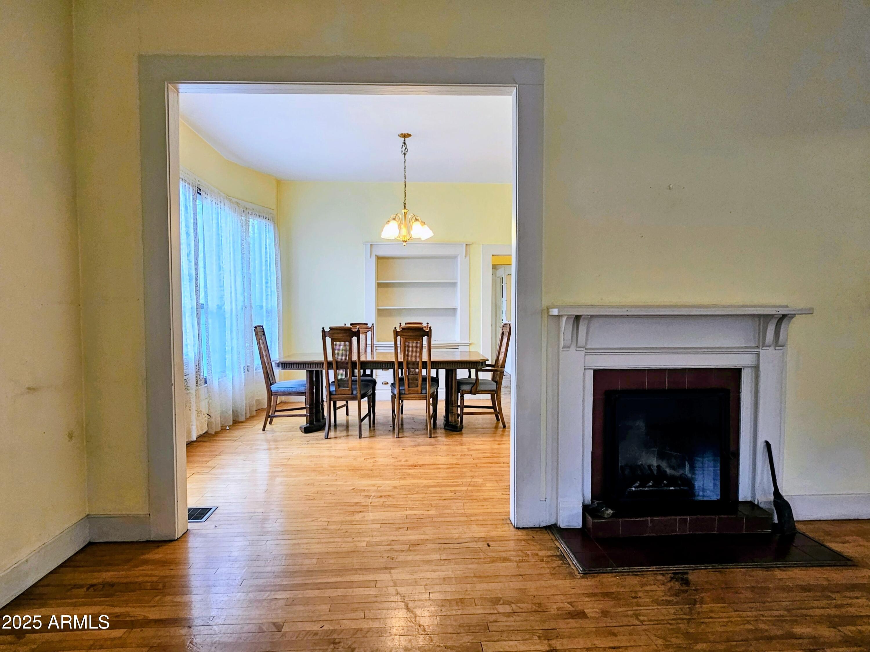 164 Quality Hill Road Bisbee, AZ 85603 - Photo 6 of 36 a living room with furniture and a fireplace
