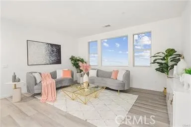 a living room with furniture flowerpot and a potted plant