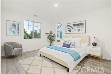 a bedroom with a bed and a couch