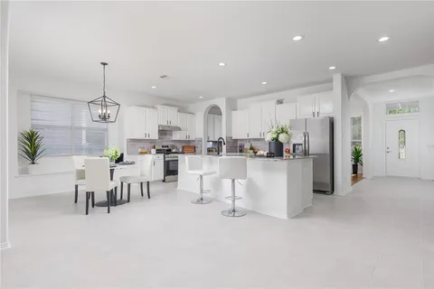 a view of a kitchen and dining room