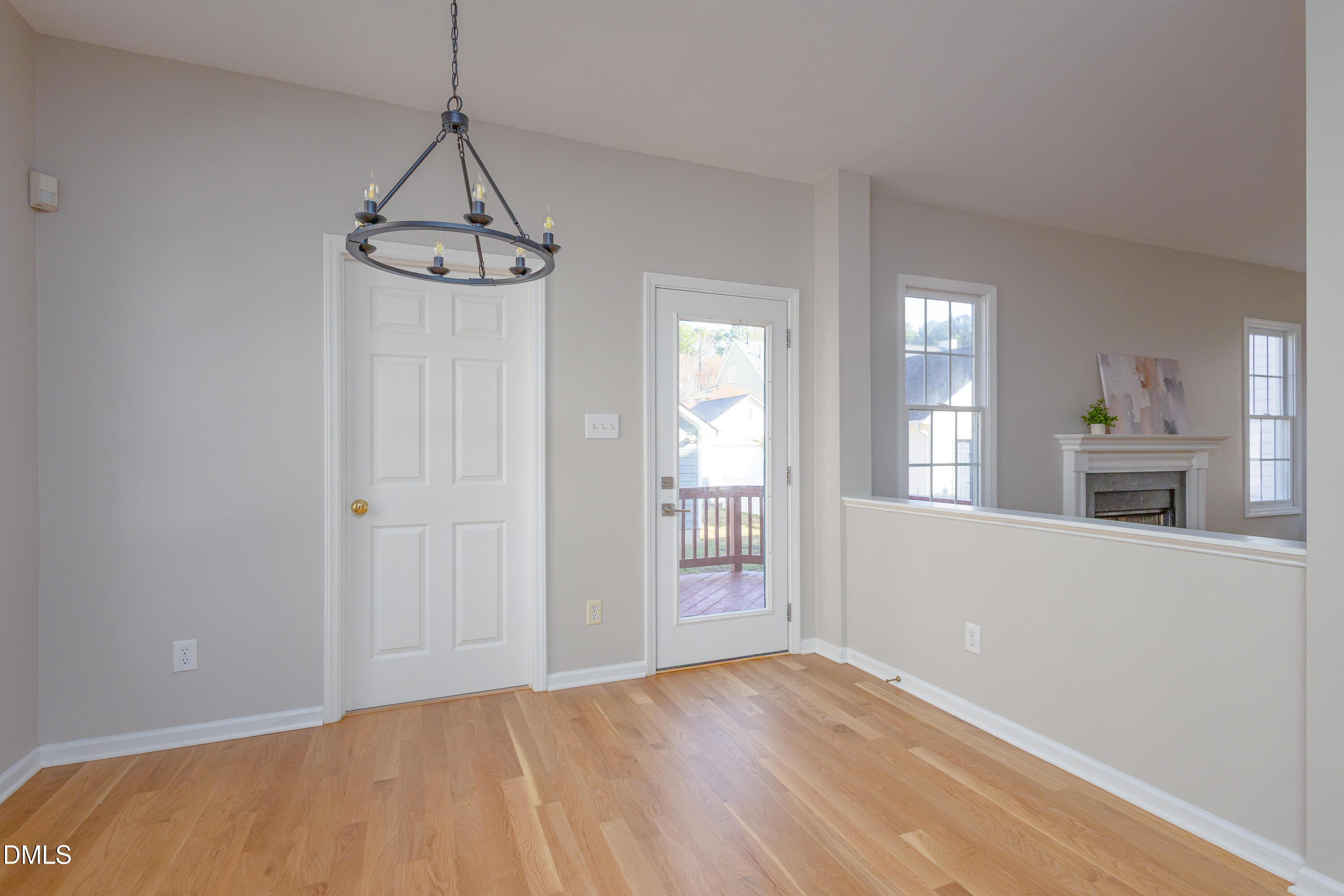 115 Chancellors Ridge Drive Durham, NC 27713 - Photo 17 of 57 a view of empty room with wooden floor and windows