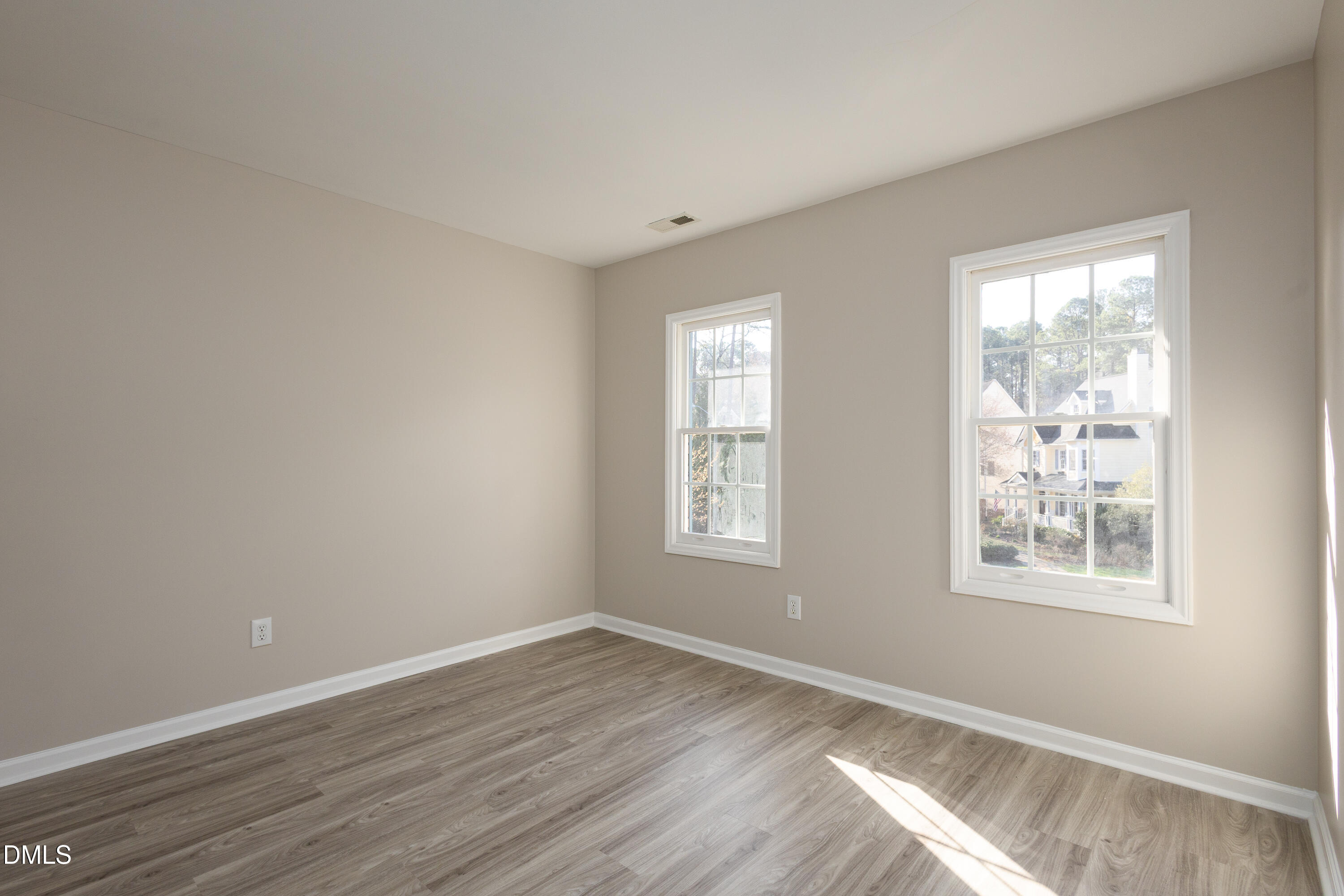 115 Chancellors Ridge Drive Durham, NC 27713 - Photo 28 of 57 a view of an empty room with wooden floor and a window