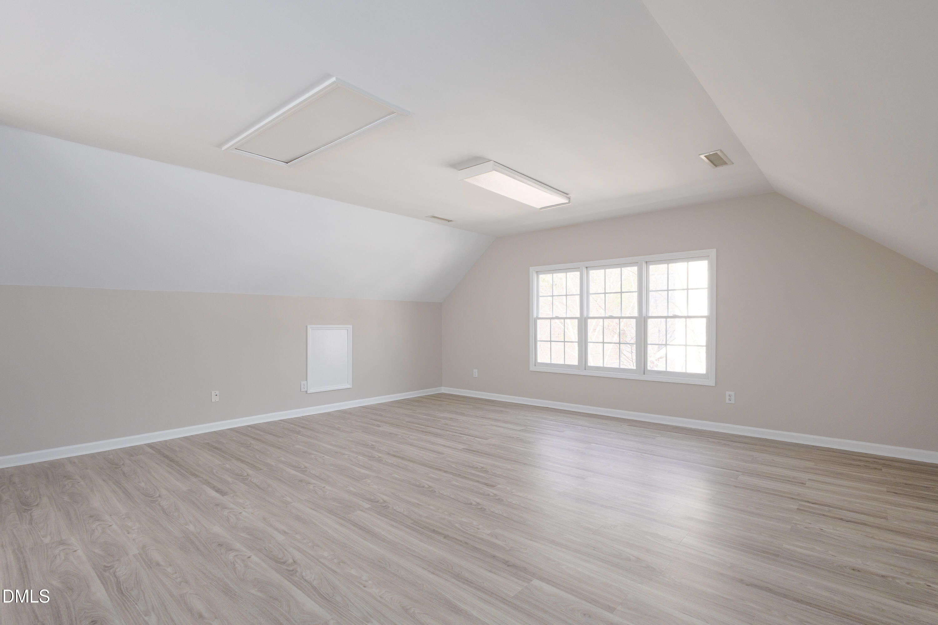 115 Chancellors Ridge Drive Durham, NC 27713 - Photo 33 of 57 an empty room with wooden floor and windows