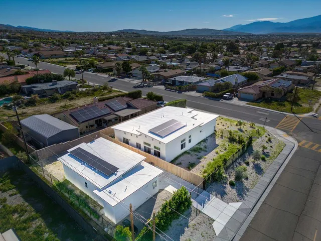 an aerial view of a house with a garden