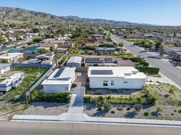 an aerial view of a house with a garden