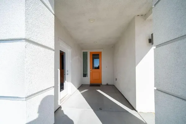 a view of a room with a hallway