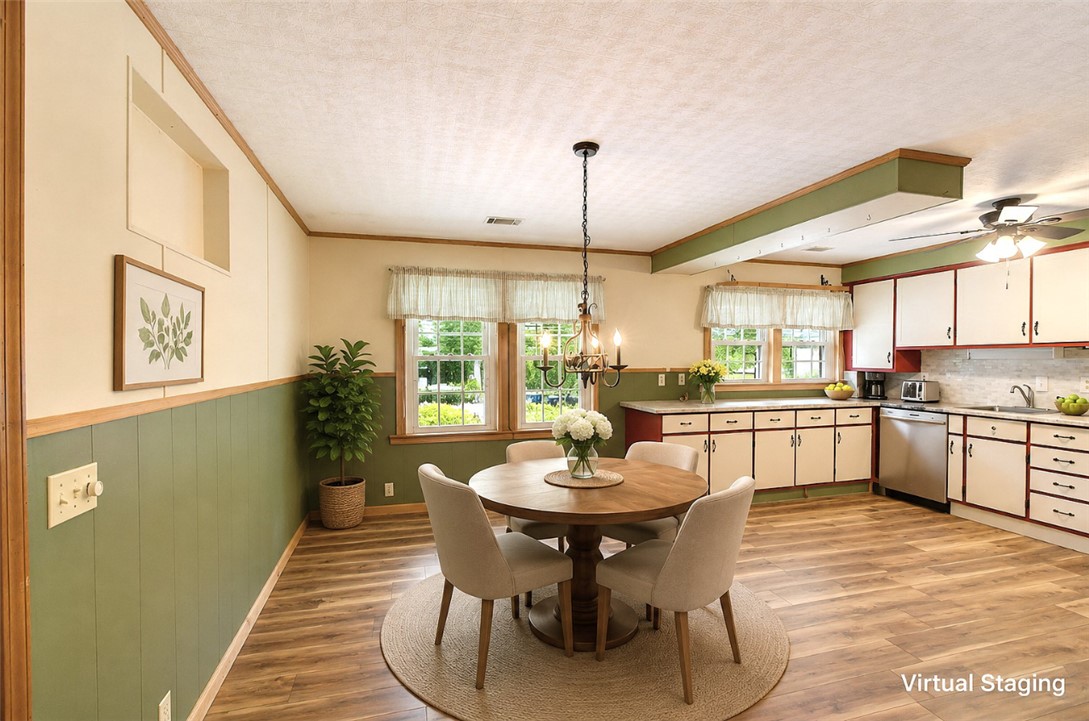 5064 Keowee School Road Seneca, SC 29672 - Photo 13 of 49 This inviting kitchen and dining area features warm wood accents and abundant natural light.