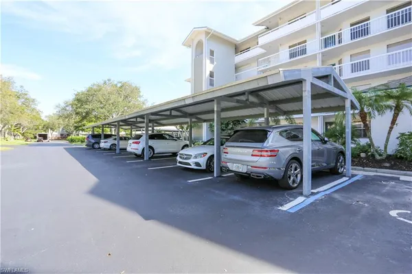 a view of cars parked in front of a building