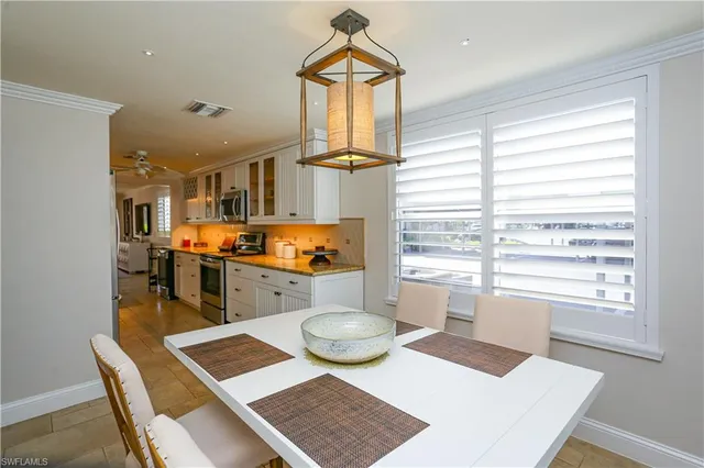 a living room with furniture a rug and a window