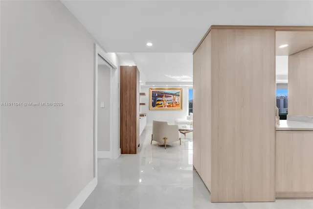a view of a hallway with bathroom