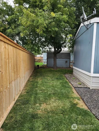 a backyard of a house with lots of green space