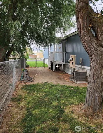 a backyard of a house with seating space
