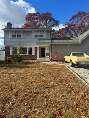 front view of a house with a yard