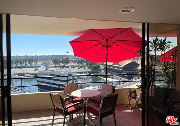 an outdoor space with furniture and umbrella
