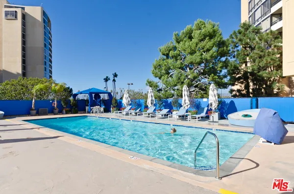a view of a swimming pool with chairs