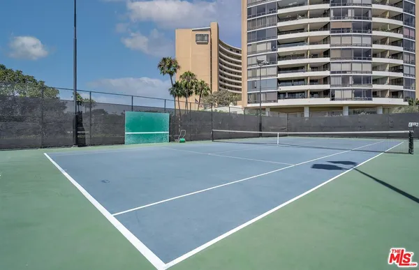 a room with lots of chairs and mirrors