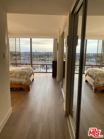 a view of living room with furniture and floor to ceiling window