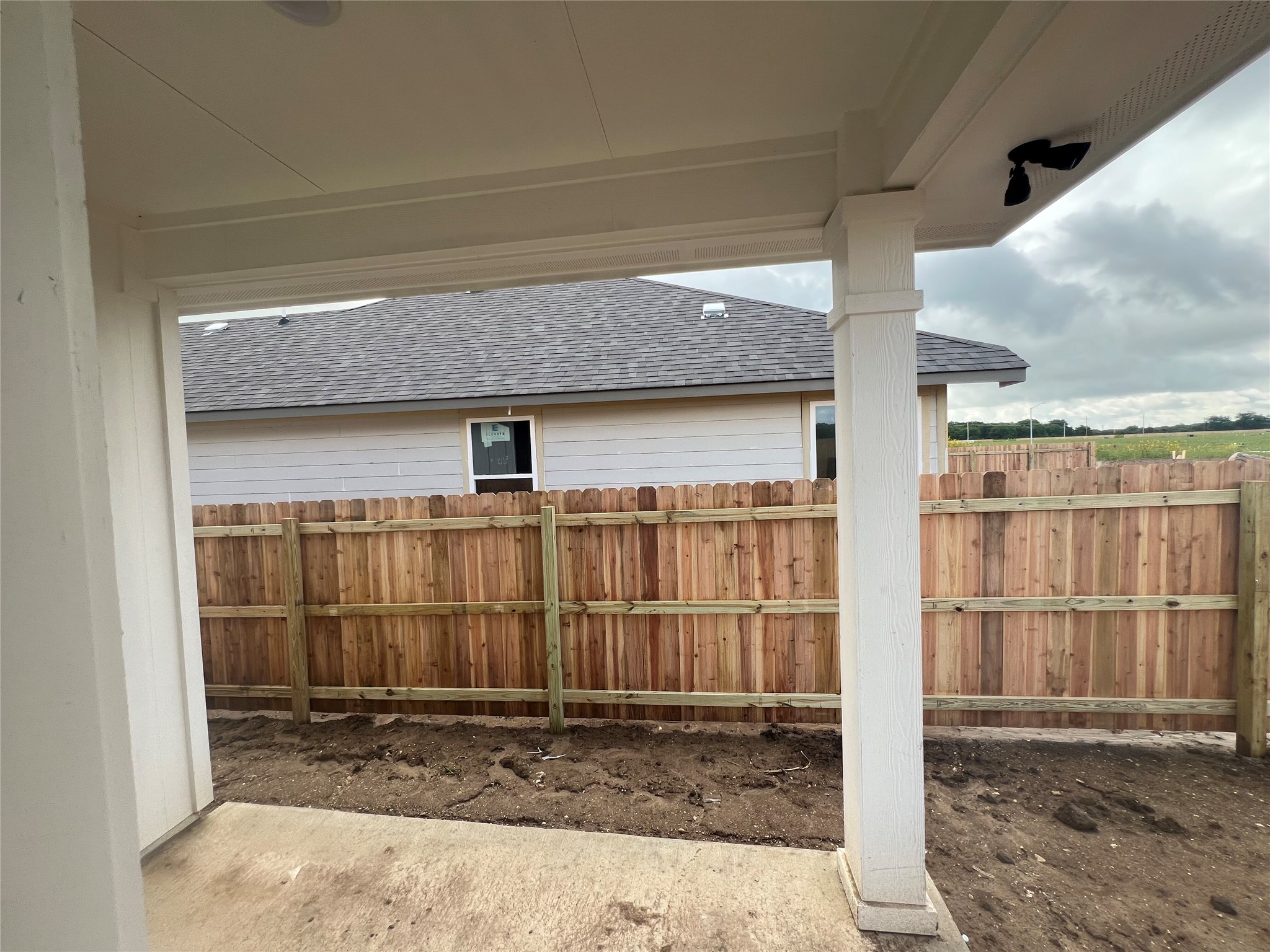 255 Gus Loop Georgetown, TX 78626 - Photo 23 of 24 A newly installed wooden privacy fence encloses the outdoor living area.