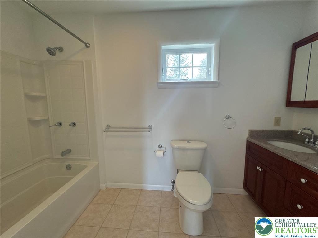 3676 Lower Saucon Road Hellertown, PA 18055 - Photo 11 of 20 a bathroom with a toilet a sink and bathtub