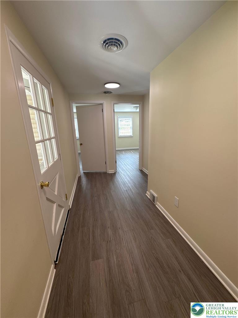 3676 Lower Saucon Road Hellertown, PA 18055 - Photo 16 of 20 wooden floor in an empty room with a window