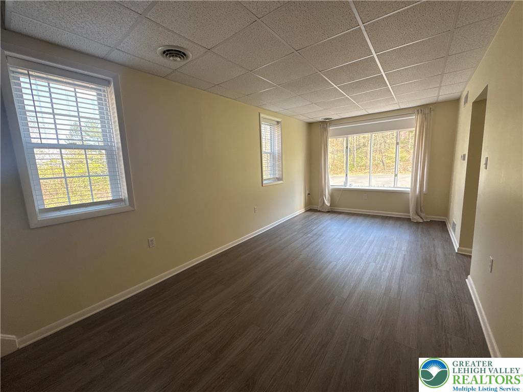 3676 Lower Saucon Road Hellertown, PA 18055 - Photo 20 of 20 a view of an empty room with wooden floor and a window