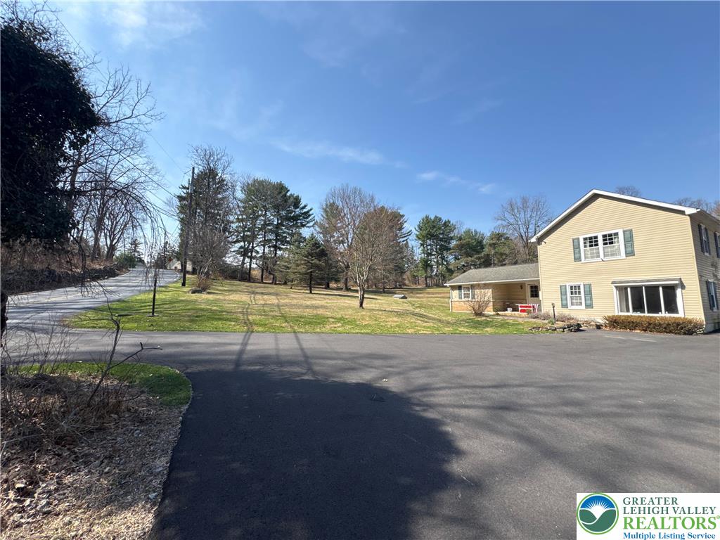 3676 Lower Saucon Road Hellertown, PA 18055 - Photo 3 of 20 a view of a house with a big yard