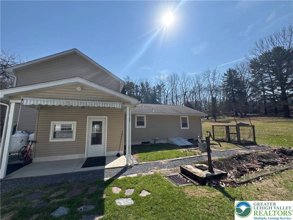 3676 Lower Saucon Road Hellertown, PA 18055 - Photo 4 of 20 a front view of a house with garden