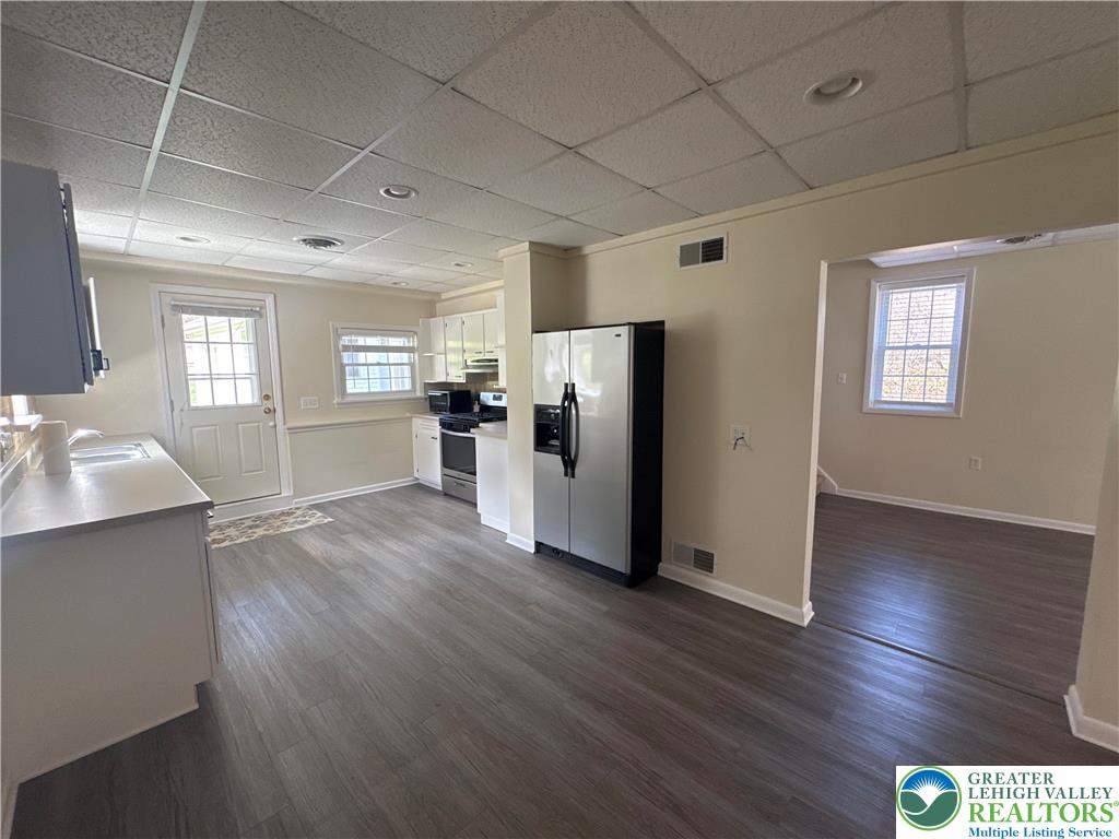 3676 Lower Saucon Road Hellertown, PA 18055 - Photo 9 of 20 a kitchen with stainless steel appliances a refrigerator and wooden floor