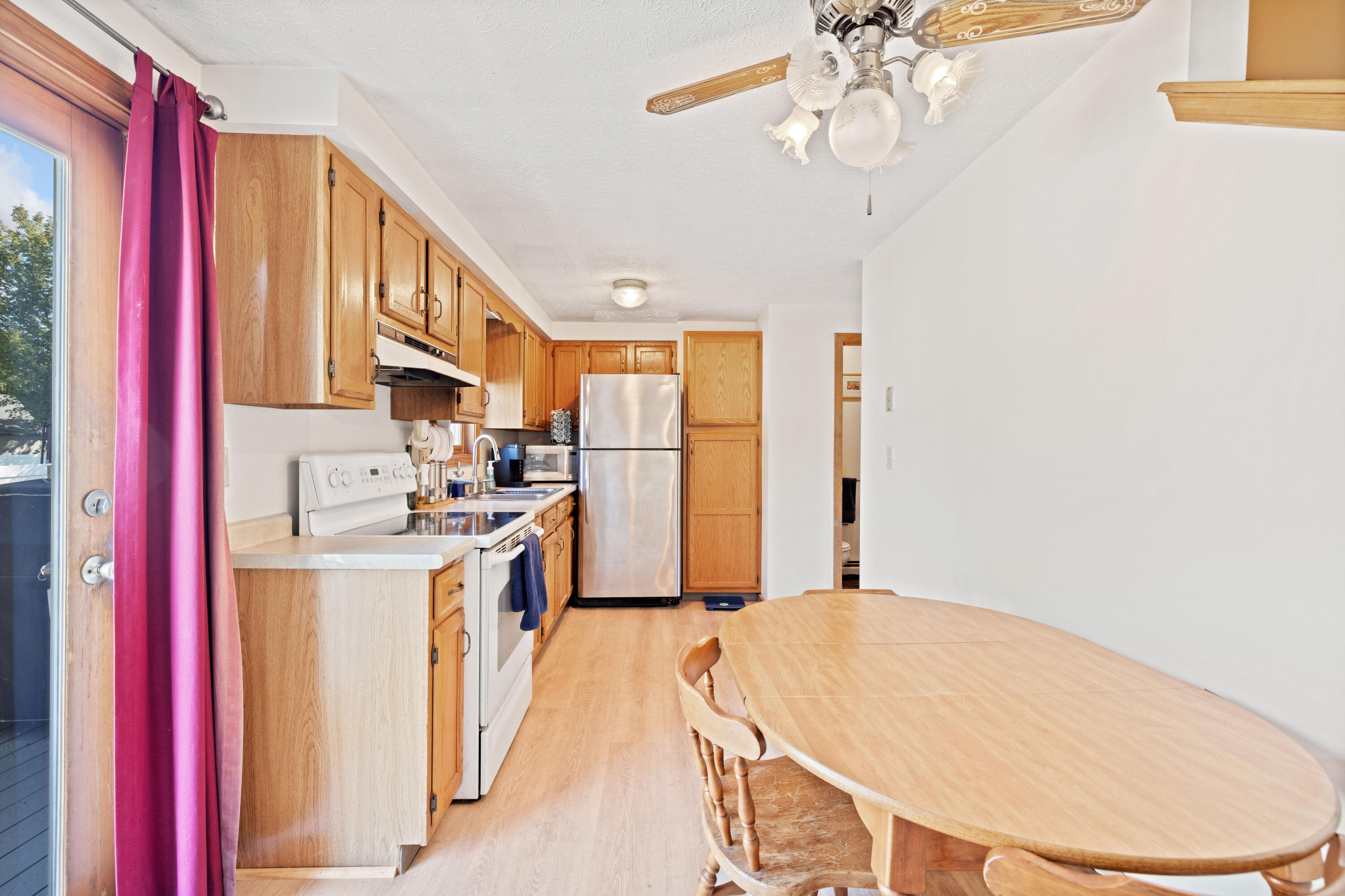 77 Maple Street, Unit 2 Saco, ME 04072 - Photo 6 of 31 Dining area leads to kitchen