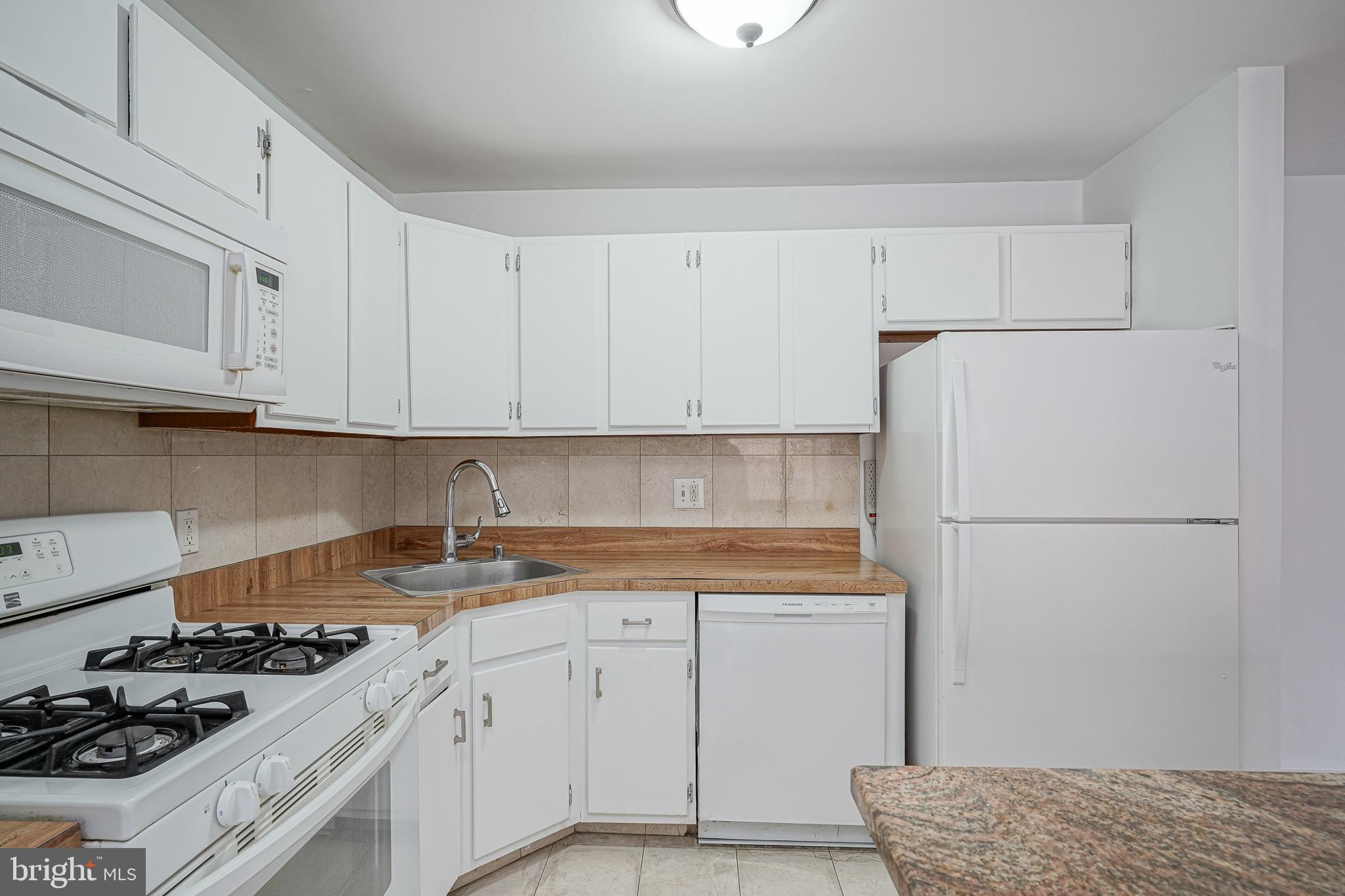 2012 Raven's Row Marlton, NJ 08053 - Photo 11 of 23 a kitchen with a white cabinets and refrigerator