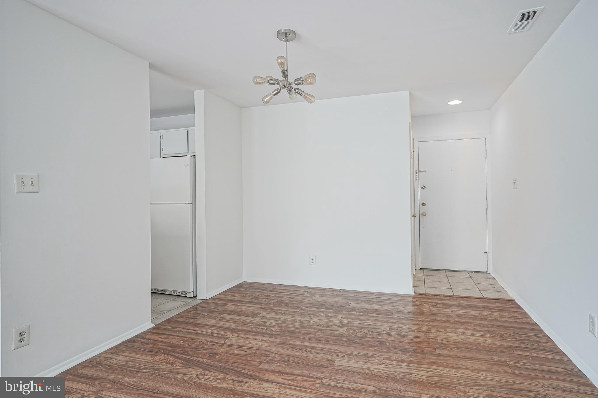 2012 Raven's Row Marlton, NJ 08053 - Photo 4 of 23 a view of empty room with wooden floor