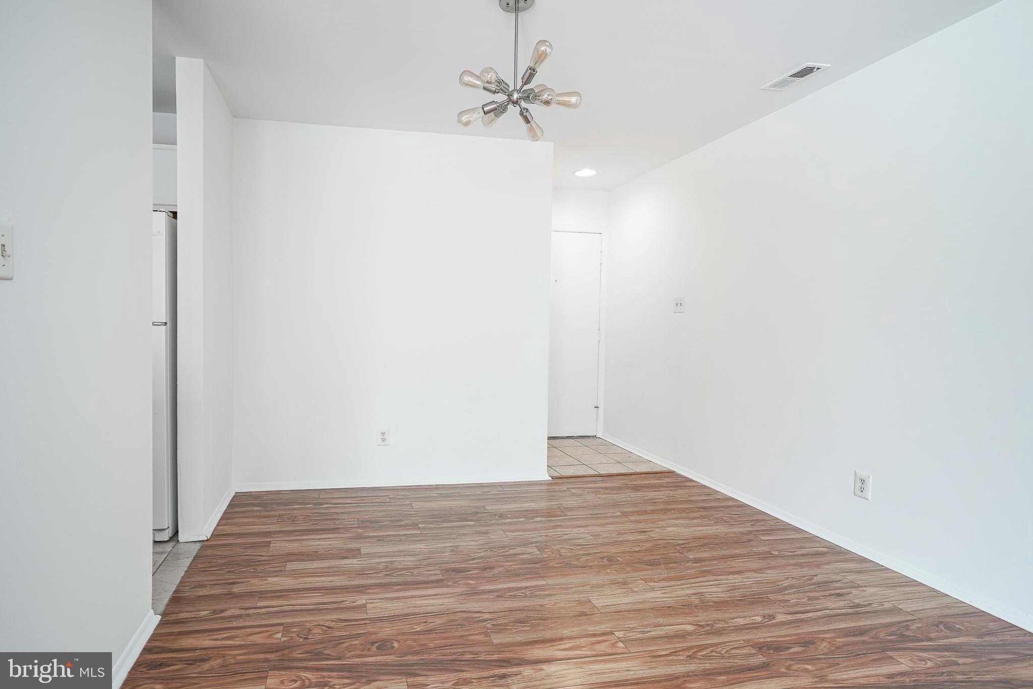 2012 Raven's Row Marlton, NJ 08053 - Photo 5 of 23 a view of an empty room with wooden floor