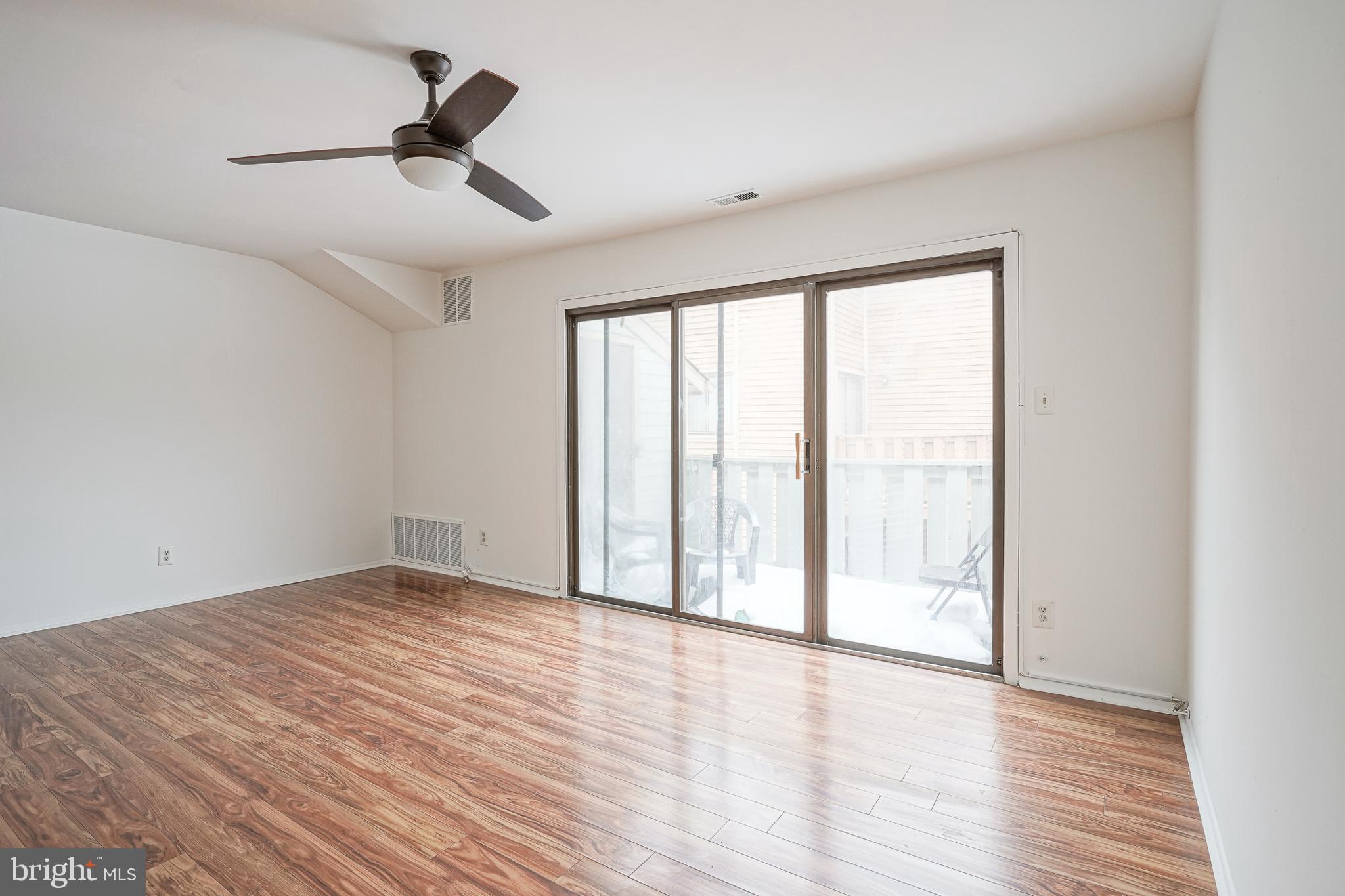2012 Raven's Row Marlton, NJ 08053 - Photo 7 of 23 wooden floor in an empty room with a window
