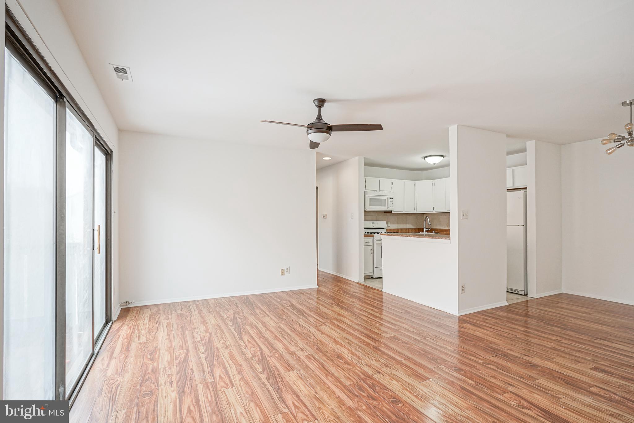 2012 Raven's Row Marlton, NJ 08053 - Photo 8 of 23 a view of a room with wooden floor and a ceiling fan