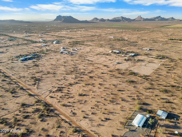 a view of aerial view of a houses with a yard