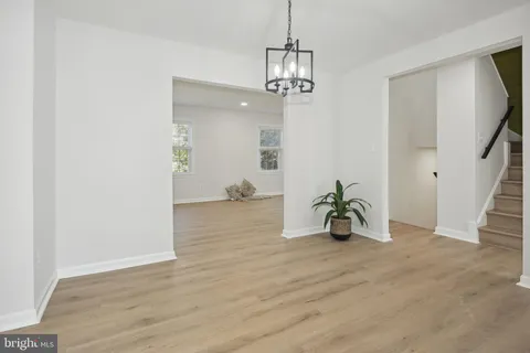 a view of livingroom with hardwood floor and hallway