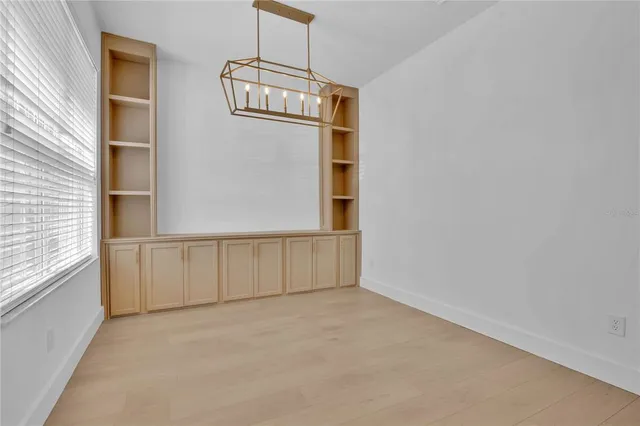 a backyard of a house with lots of green space and fountain