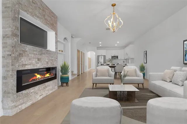 a kitchen with stainless steel appliances a refrigerator sink and cabinets