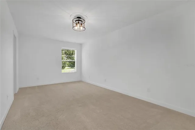a aerial view of a residential houses with yard