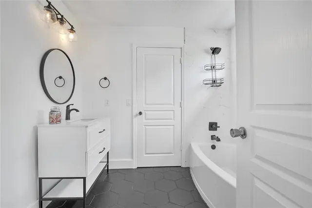 an aerial view of residential house with outdoor space and lake view