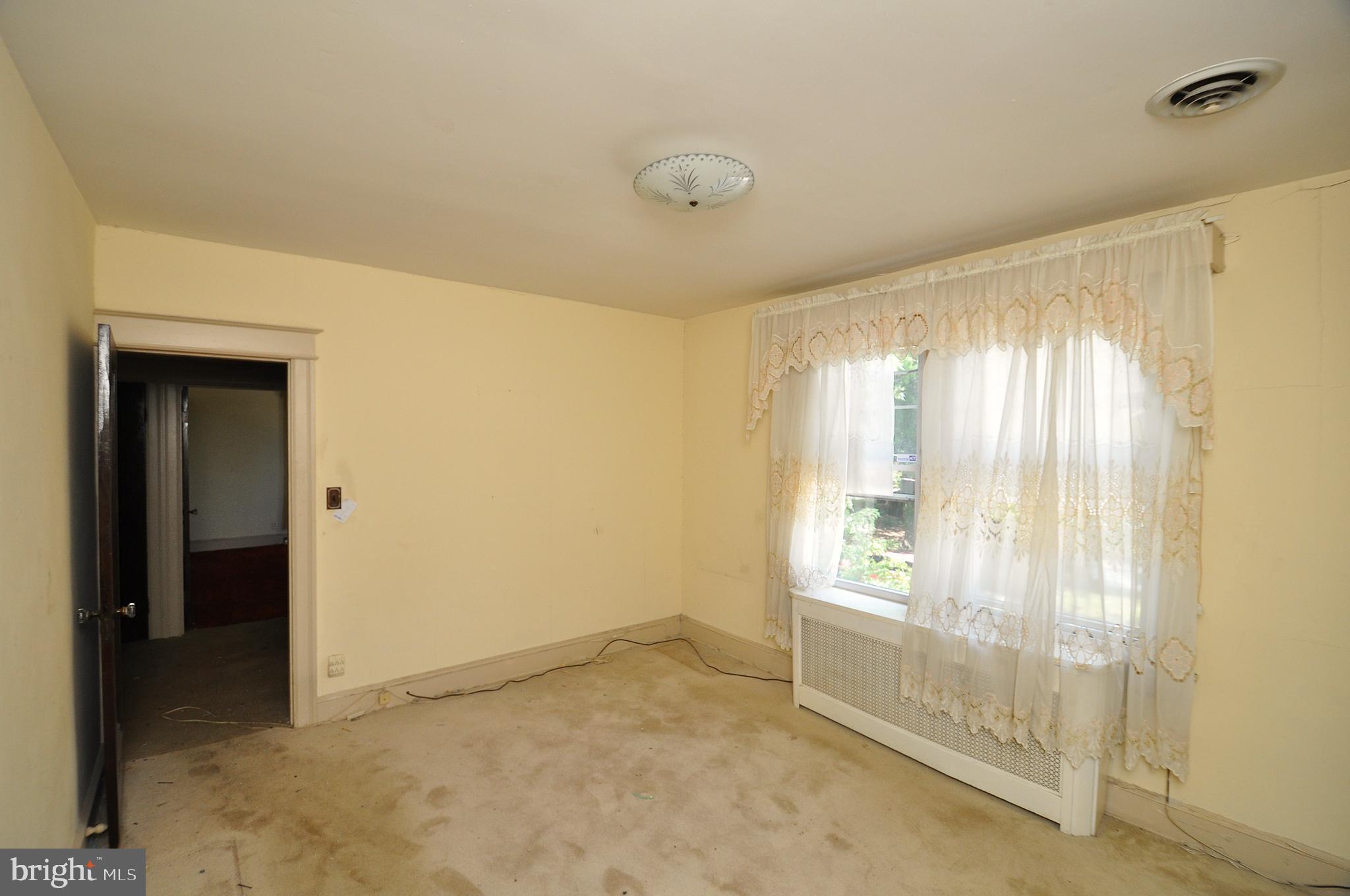 1619 Evarts Street Northeast Washington, DC 20018 - Photo 14 of 20 a view of an empty room with a window