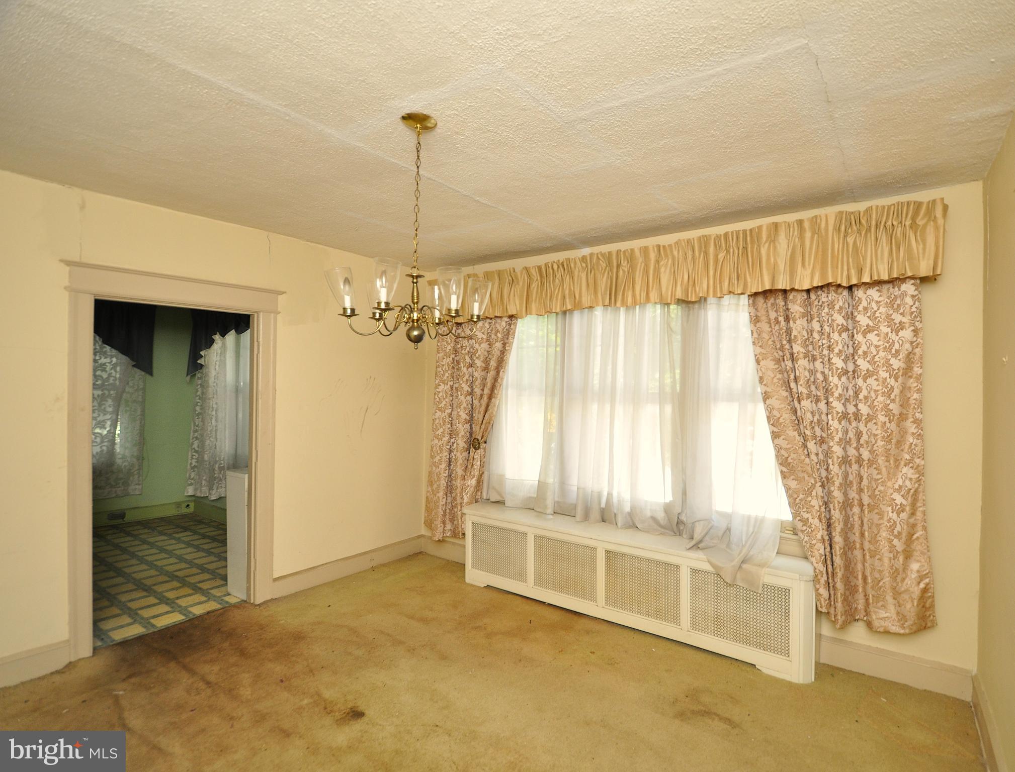 1619 Evarts Street Northeast Washington, DC 20018 - Photo 7 of 20 a view of an empty room with a window