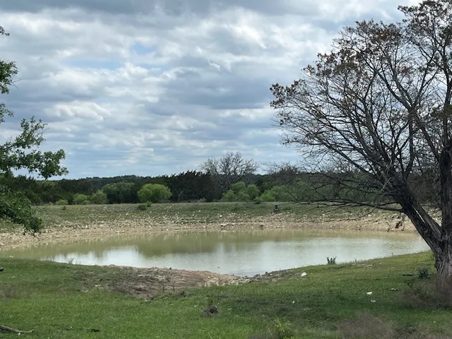 a view of a lake with a big yard