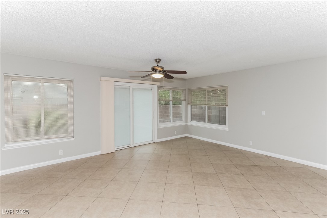 4737 Monaco Road Las Vegas, NV 89121 - Photo 10 of 21 Spare room featuring ceiling fan and a textured ce