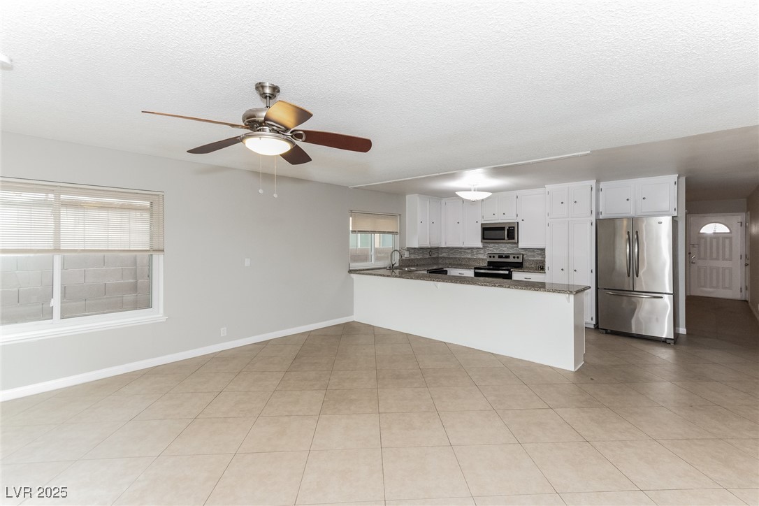 4737 Monaco Road Las Vegas, NV 89121 - Photo 11 of 21 Kitchen featuring stainless steel appliances, a pe