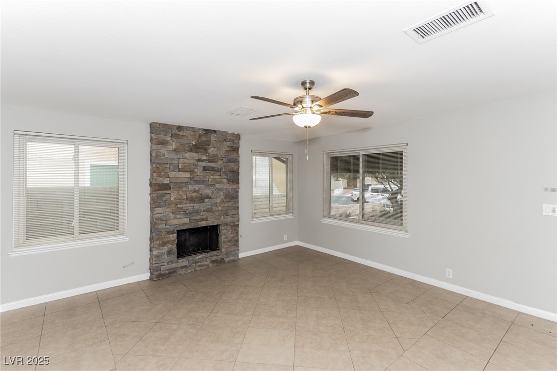 4737 Monaco Road Las Vegas, NV 89121 - Photo 6 of 21 Unfurnished living room with a ceiling fan and a s